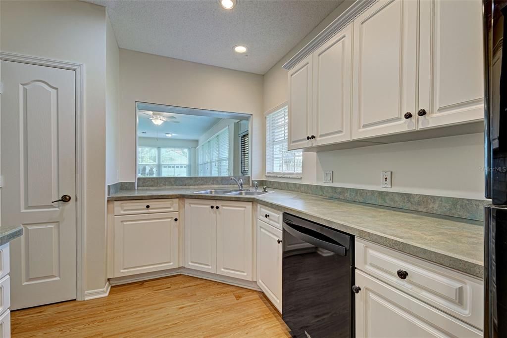 Kitchen has plenty of counter space, many cabinets and pantry.