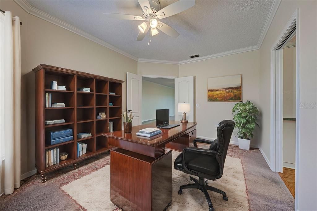 3rd bedroom is virtually staged as a home office.