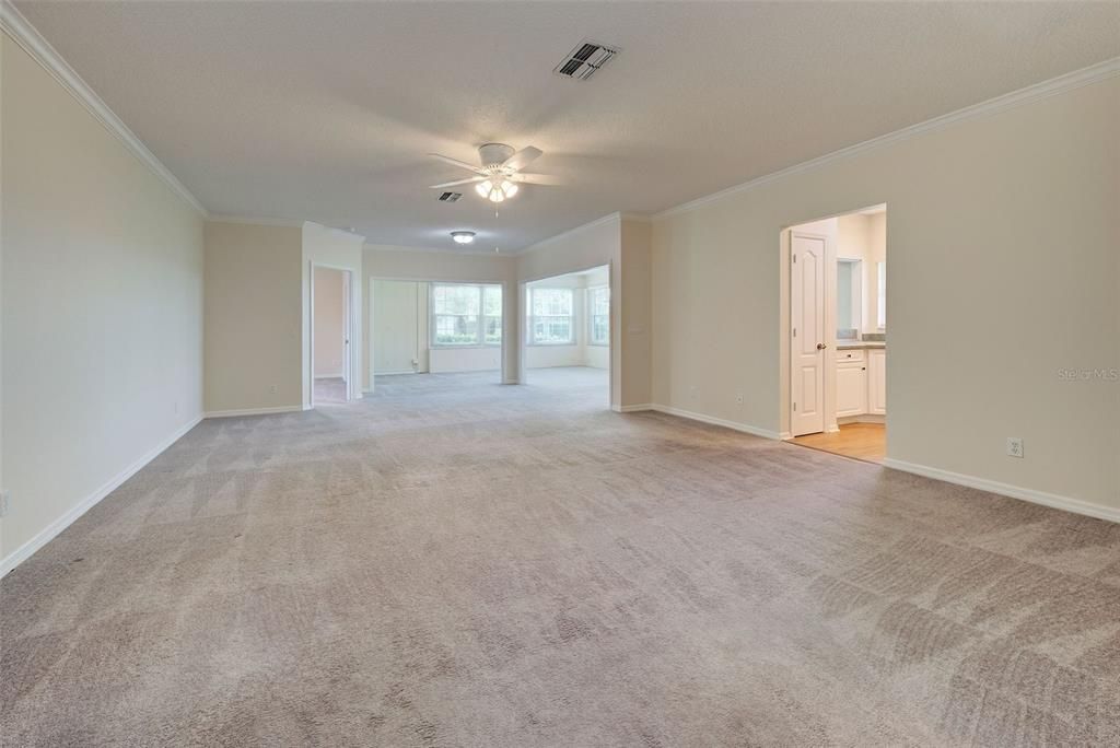 View of bright and airy great room.   Entertaining is a breeze with great room leading to large Florida room and kitchen.