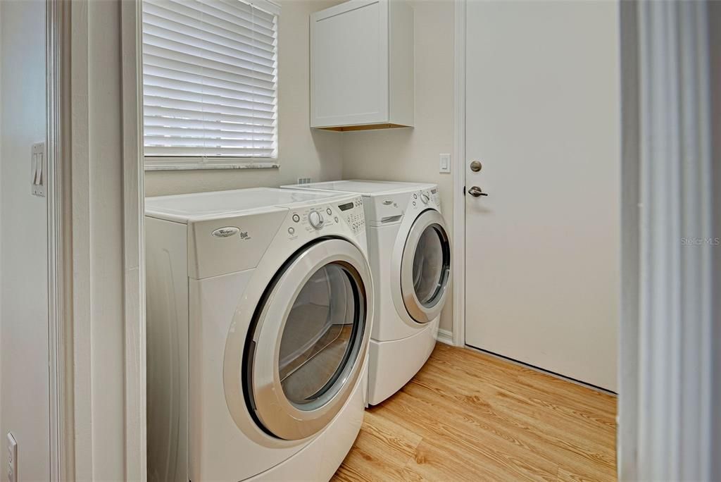 Interior laundry room, conveniently located between the kitchen and garage.