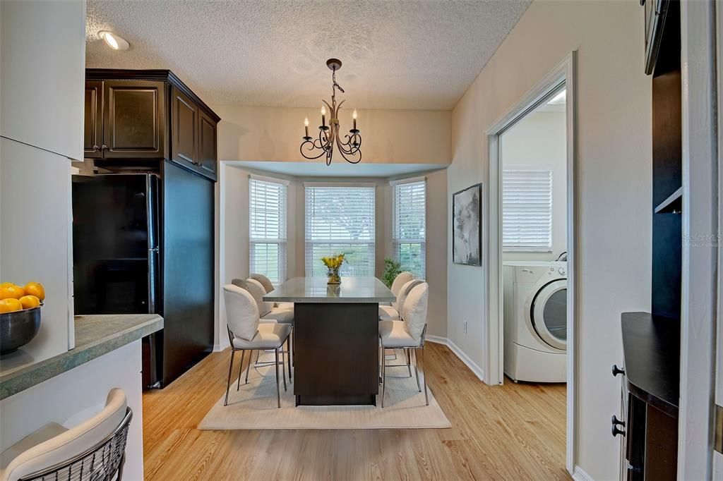 Virtually staged breakfast nook area is sunny, just right for a casual meal.