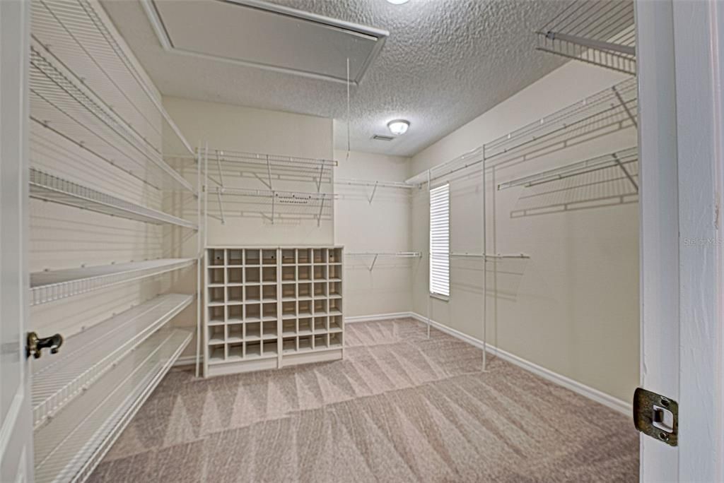 Wow - what a closet (10x13)!  Primary walk-in closet will meet all of your storage needs.