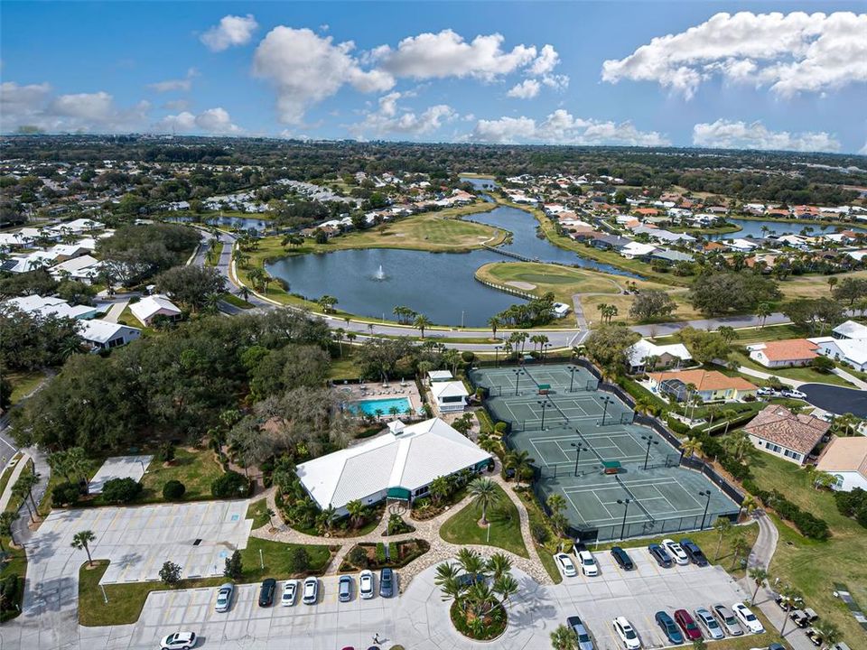 Bird's eye view of Waterford's clubhouse, community pool and har tru tennis courts.