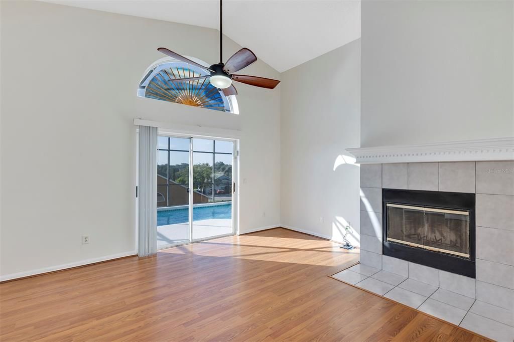 View from Kitchen through Family Room to Screened Pool