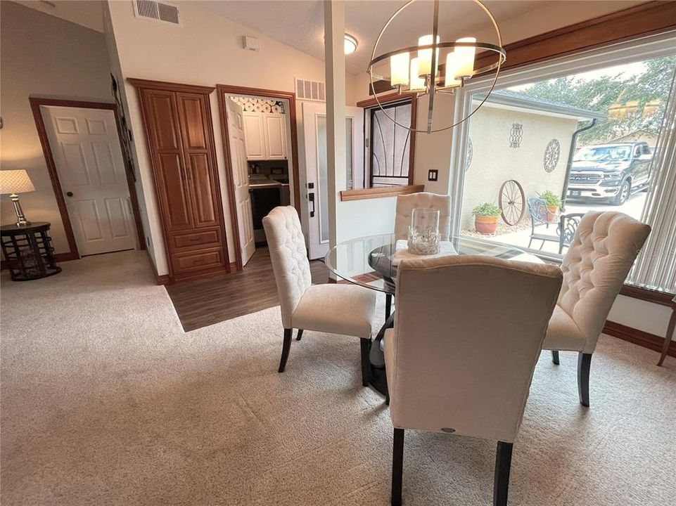 Dining room with picture window to front, looking towards primary BR