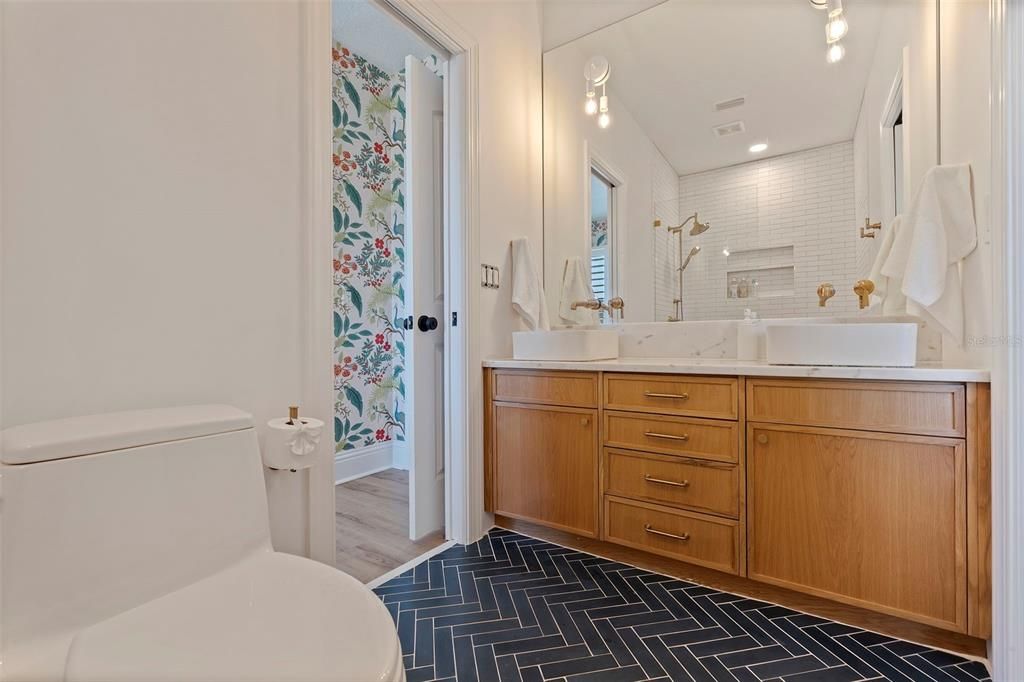 Jack-n-Jill bathroom with Cle tile, brizo hardware and double sink vanity.