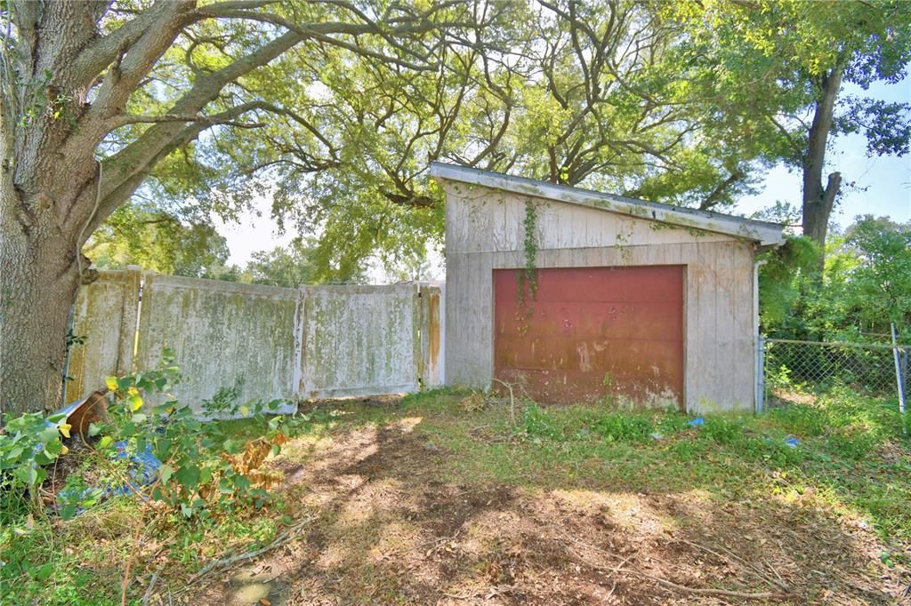 Ally view of detached garage, on rear of property