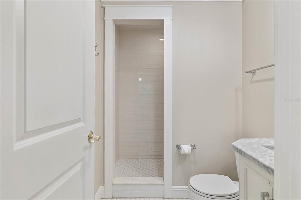 Another angle of the en-suite bathroom and step-in shower offering privacy.