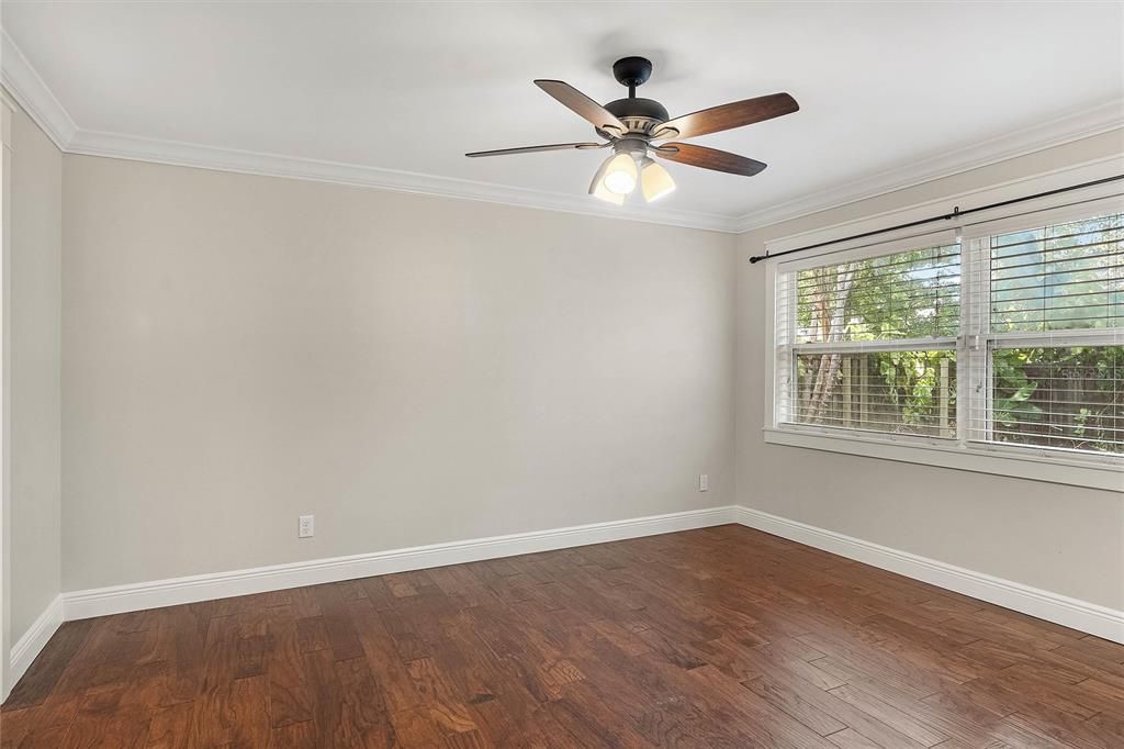 Primary bedroom overlooking the backyard