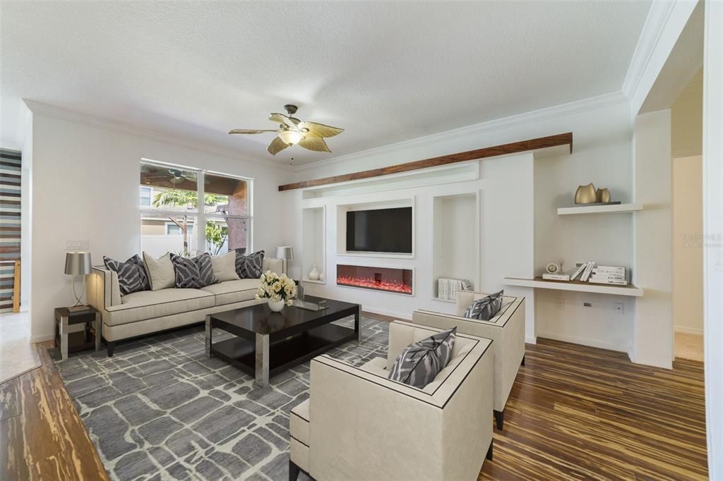 The main living areas are all open to each other with WOOD & TILE FLOORING for easy maintenance - your living room has unique built-ins and crown molding adding a touch of character you can build on...Virtually Staged.