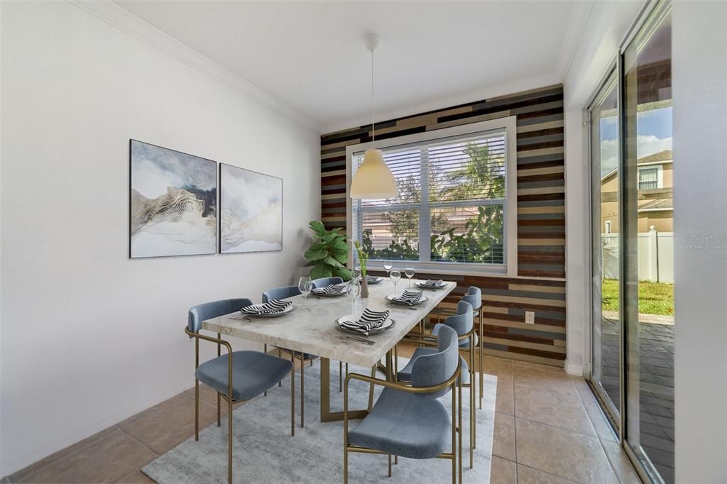 And the dining area has a large picture window, sliding glass door access to the lanai and the feature wall ties all three spaces together! Virtually Staged.