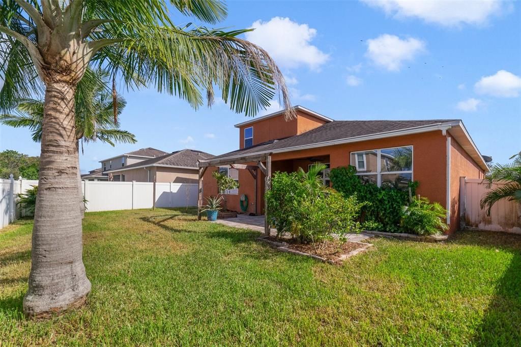 There is FRESH PAINT and NEW CARPET throughout, a covered paver lanai and the nice sized backyard is fully fenced for added privacy.