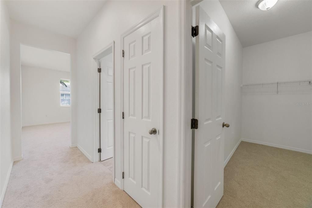 PRIMARY WALK-IN CLOSET & PRIVATE EN-SUITE BATH.