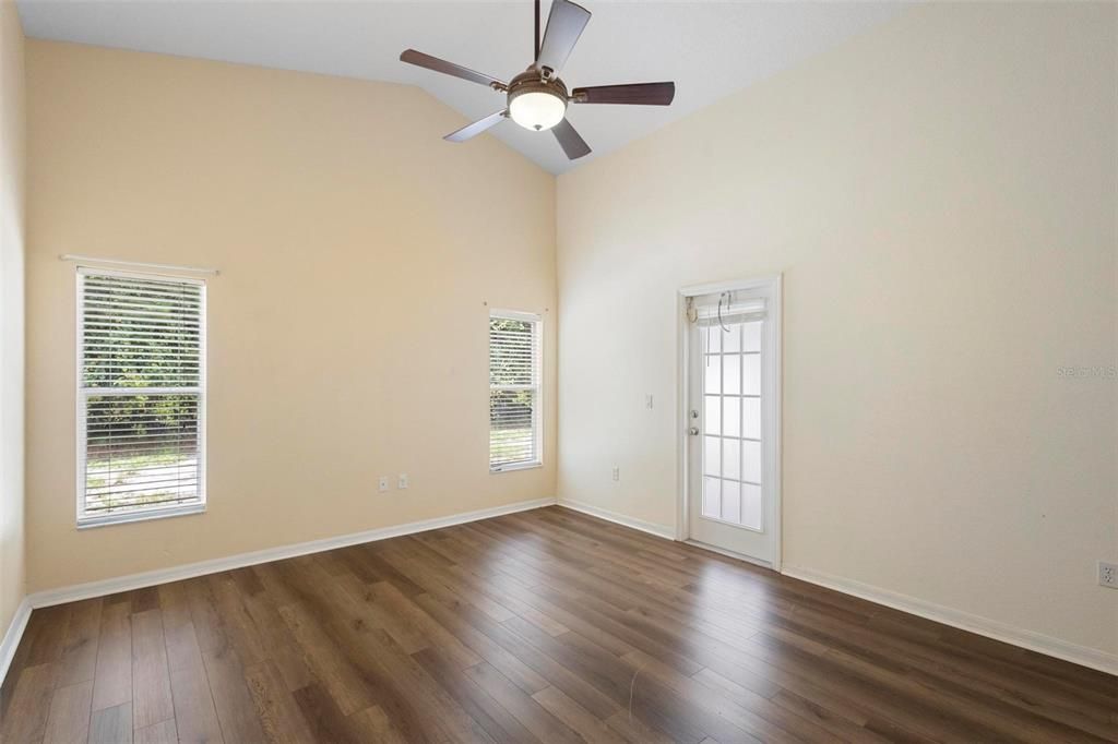 Primary Bedroom single French door leads to Porch