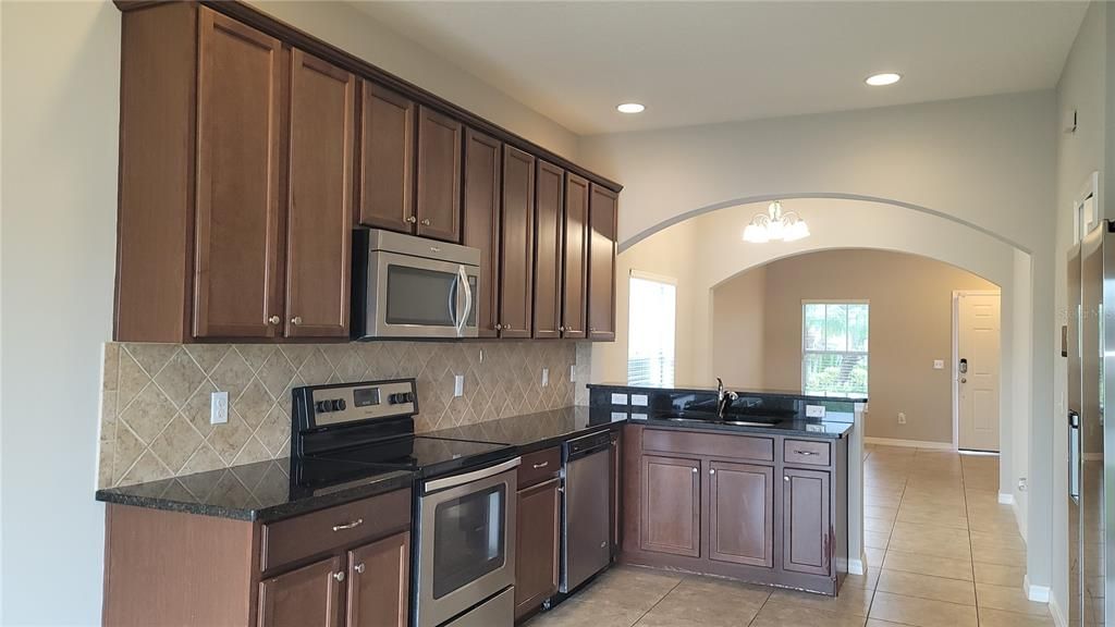 Large open kitchen with dinette overlooking the pond