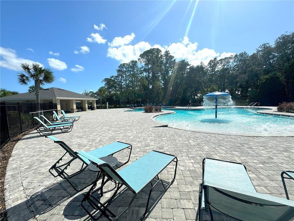 Community Gated Swimming Pool with Lawn Chairs