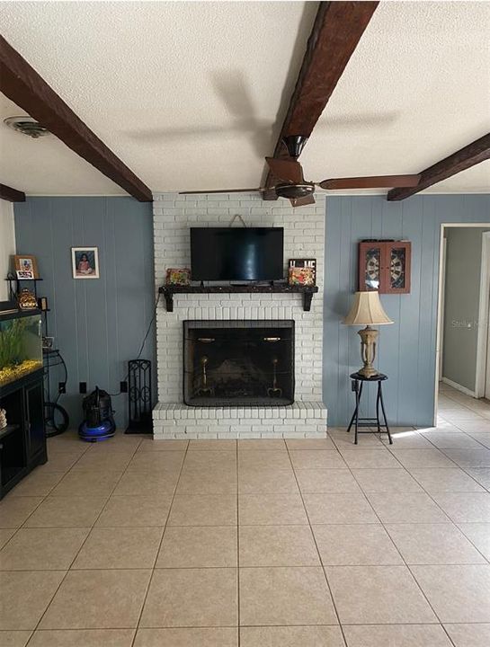 family room with wood burning fireplace