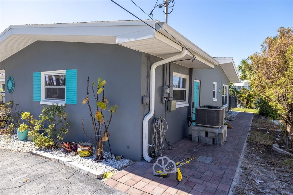 Walkway towards backyard. Door to garage.