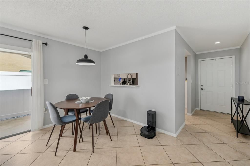 Dining Room Opens up into the Living Room and Access to the Outdoor Patio