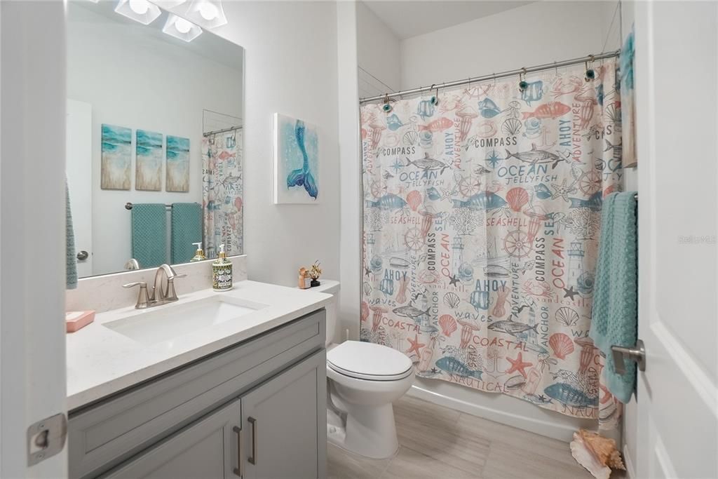 Second bathroom. Shower with tub.