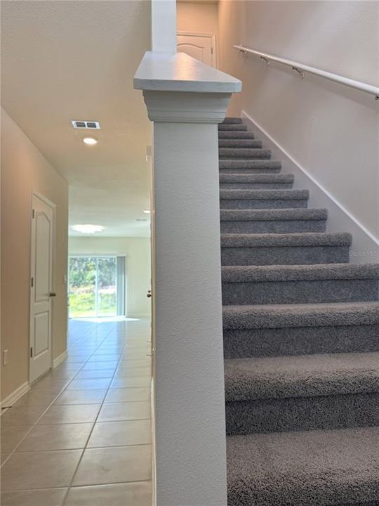 Interior - Foyer Entrance Carpeted Stairs