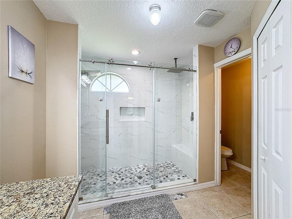 Owners En-Suite Bath with large Walk-in Shower and Private Water Closet