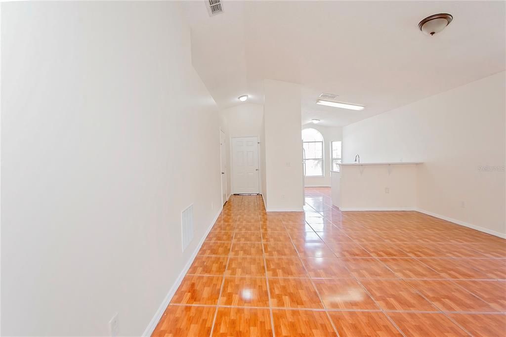 Living Room w/view of Kitchen + Entry