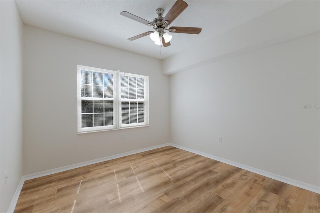 Guest Bedroom with view out to pond.