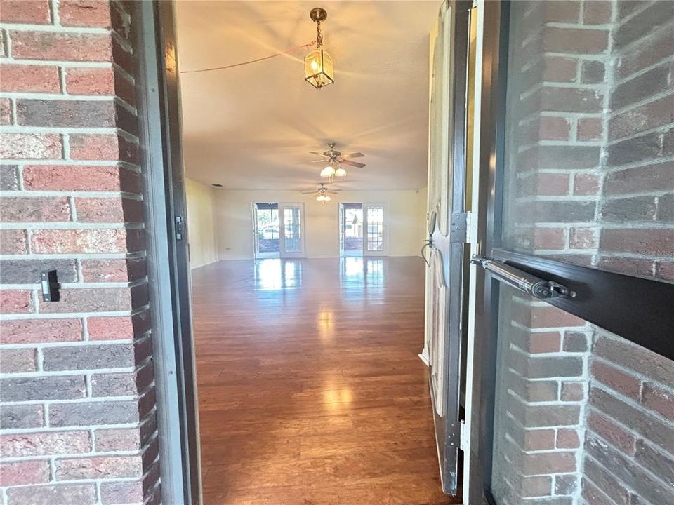 A sprawling open floor plan with gleaming floors