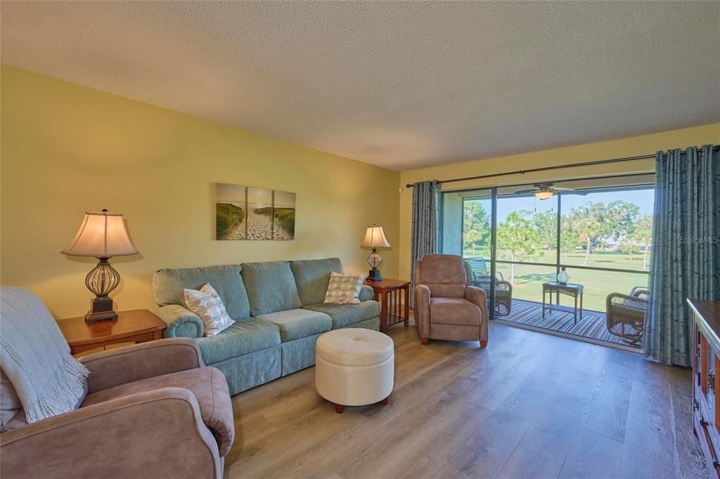 Private screened lanai is just beyond the living room