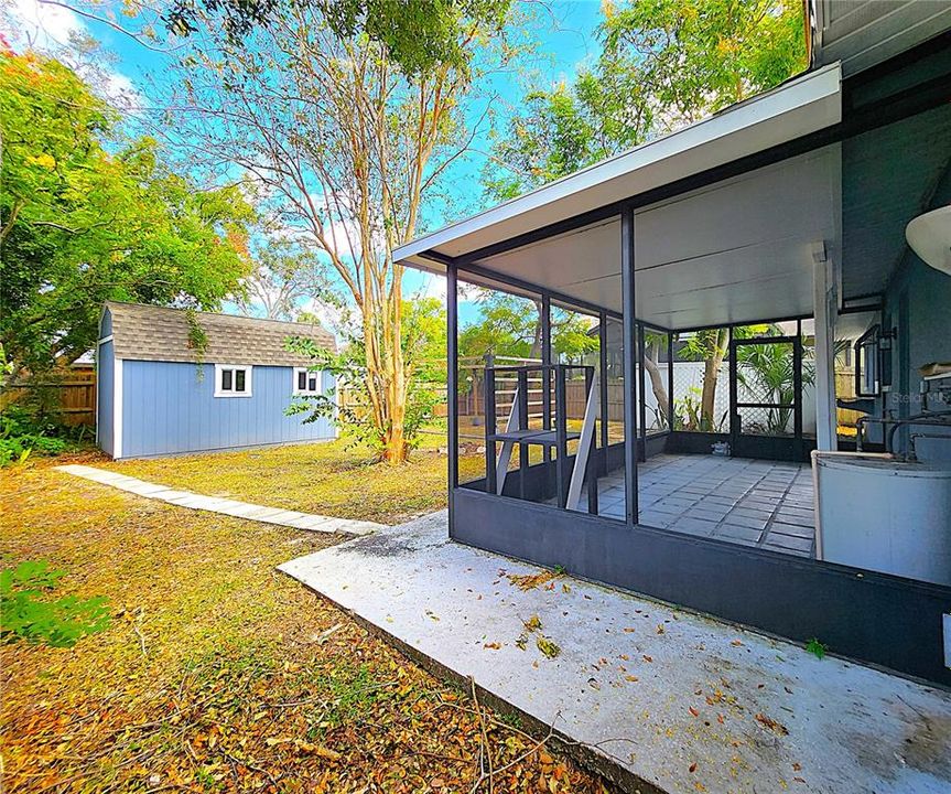 Screened in lanai houses the water heater and a pest control device