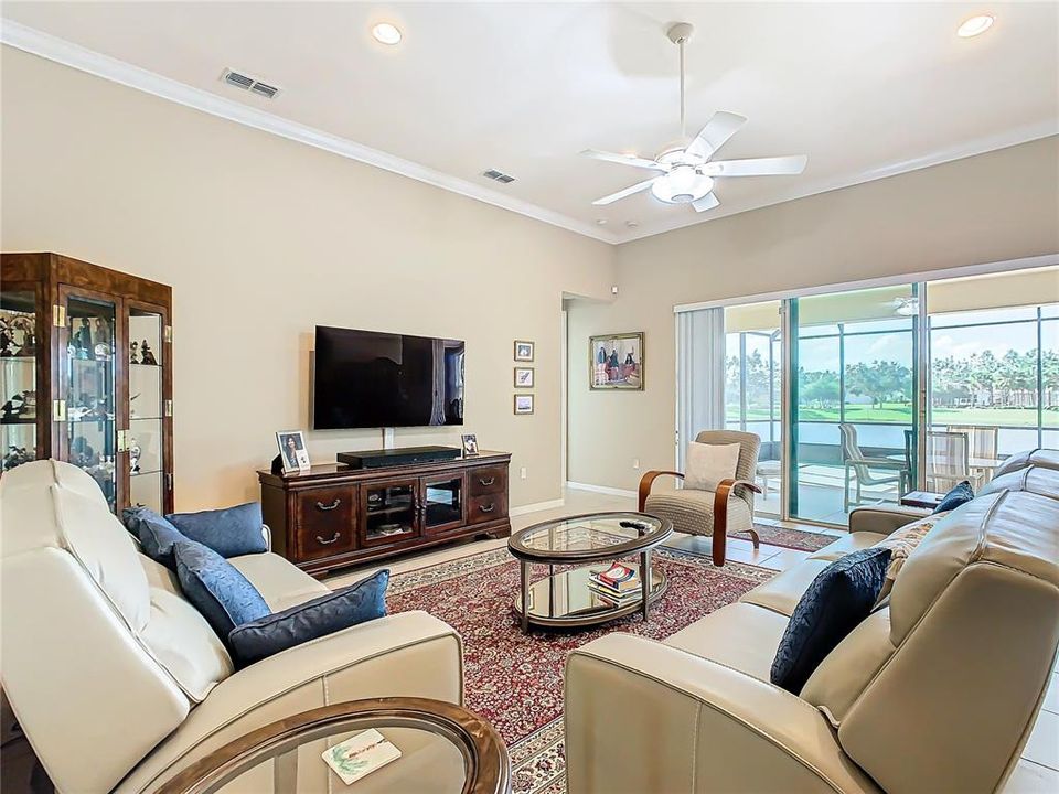 FAMILY ROOM WITH SLIDING DOORS TO LARGE SCREENED LANAI