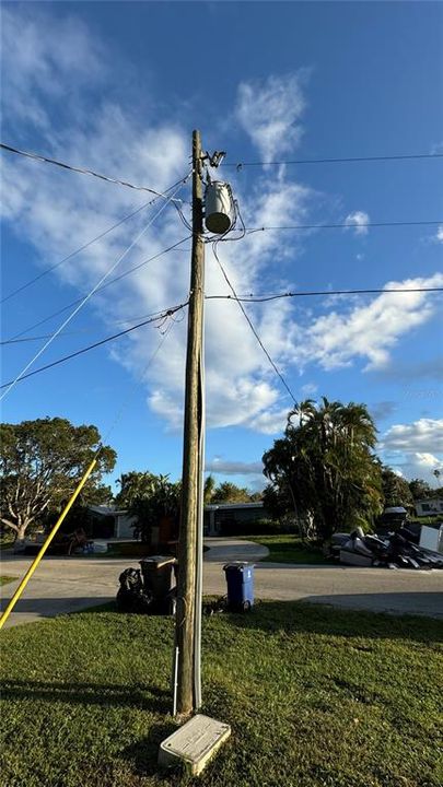 UTILITY POLE LOCATED AT COROER OF PROPERTY.