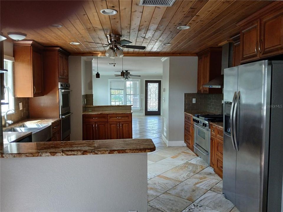 view from dining room thru the kitchen toward living room