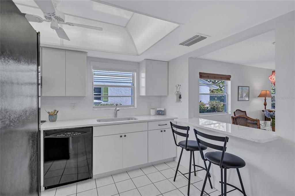 Kitchen with in-unit laundry.