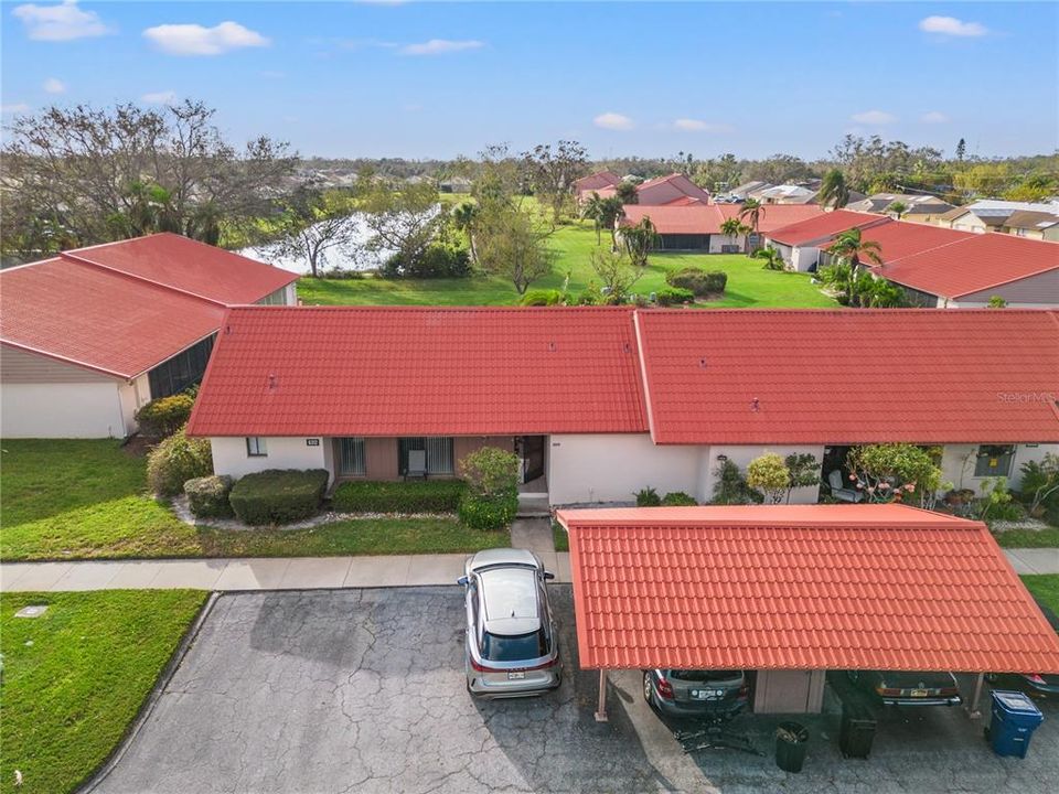 Aerial View of Condo/Parking/Pond/Backyard