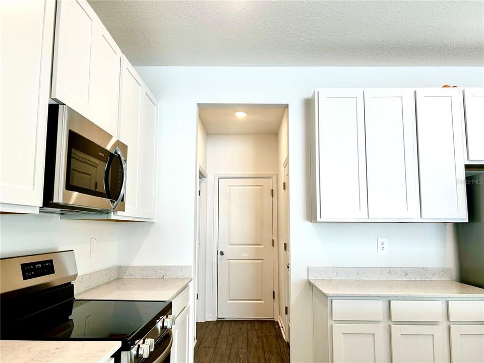 Kitchen Toward Garage, 1/2 Bathroom, Laundry Room