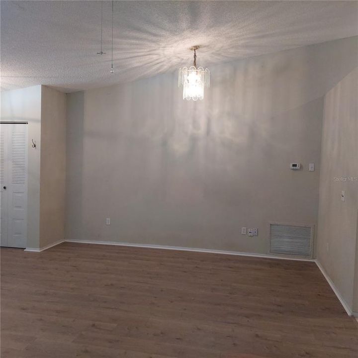 part of great room, new laminate flooring, cathedral ceiling