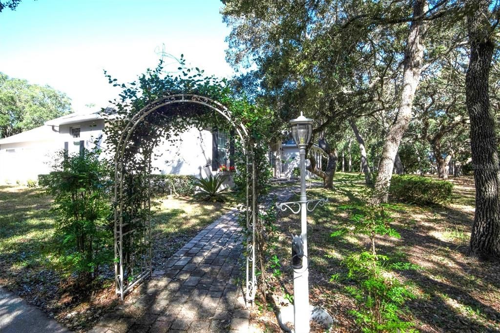 Arbor & Pavered Walkway To Covered Front Entry