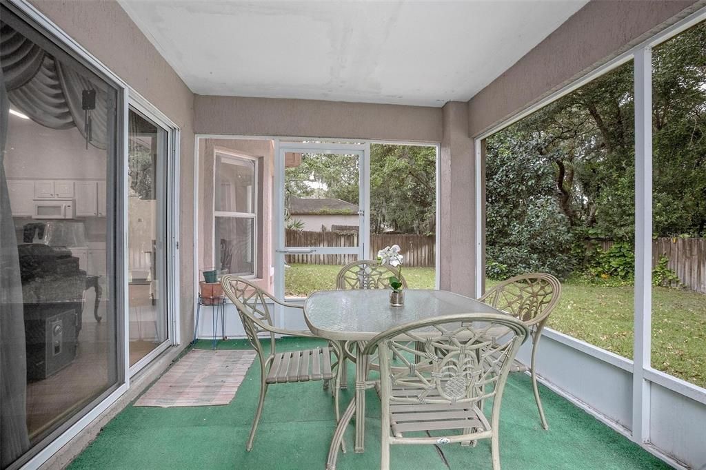 Sliding Doors open to Covered Screened porch