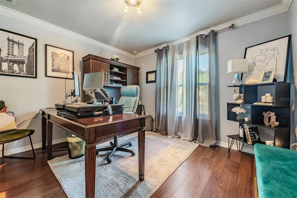 Guest bedroom or office with French doors, full closet in the room.