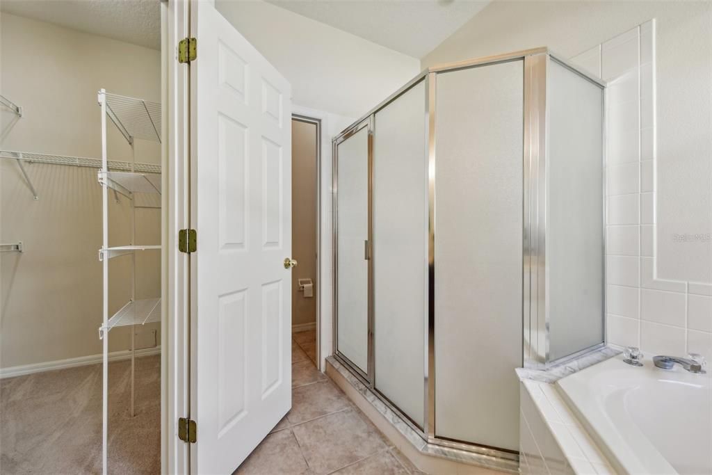 Large Primary Bathroom with Double Vanity, Garden Tub, Stand Up Shower, Water Closet and Natural Light!