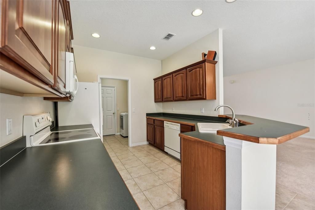 Generous Sized Kitchen with lots of potential!