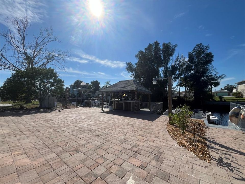 Pavered patio with tiki bar