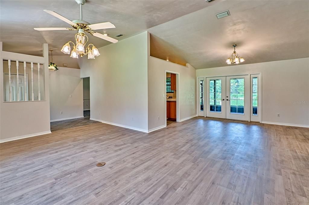 vaulted ceilings in formal living & dining room