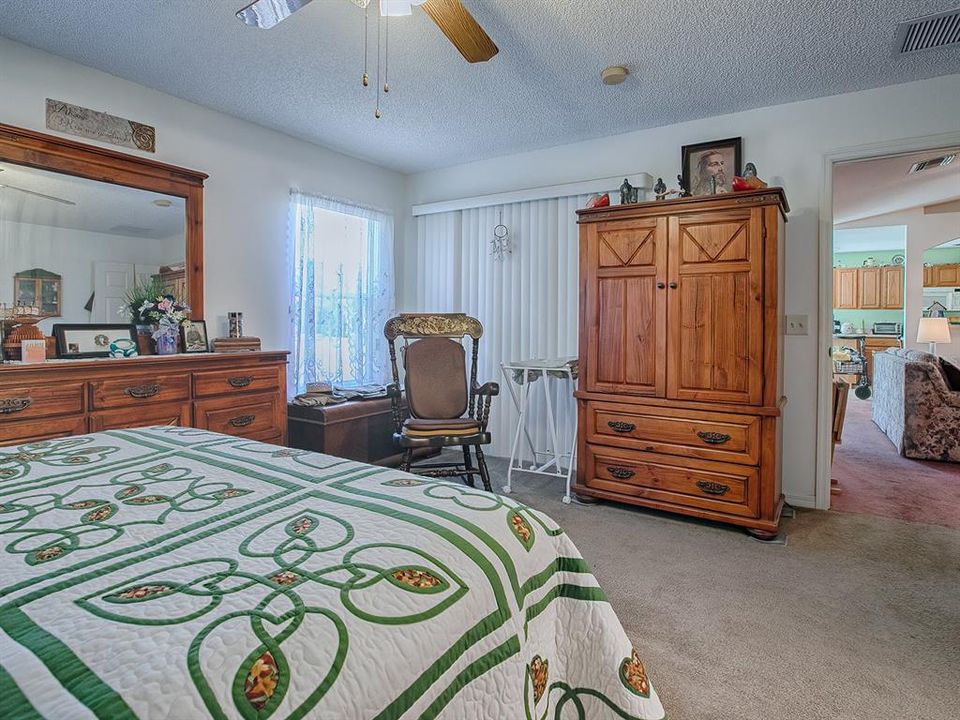 GLASS SLIDERS FROM THE MASTER BEDROOM LEAD INTO THE LANAI