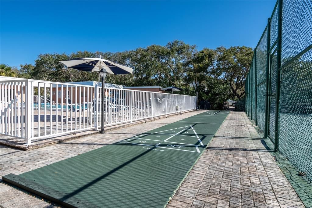 Shuffleboard by the pool is fun!