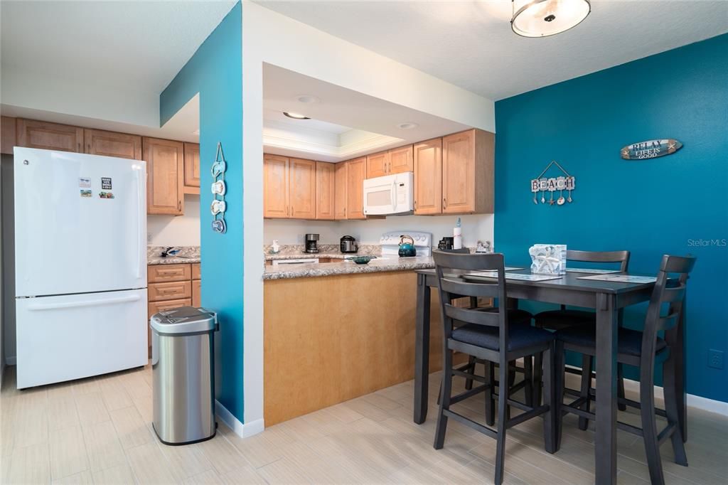 Dining area towards kitchen.