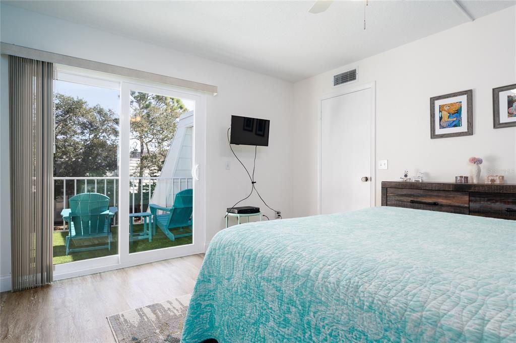 Primary bedroom towards patio entrance (left) and room entrance (right).