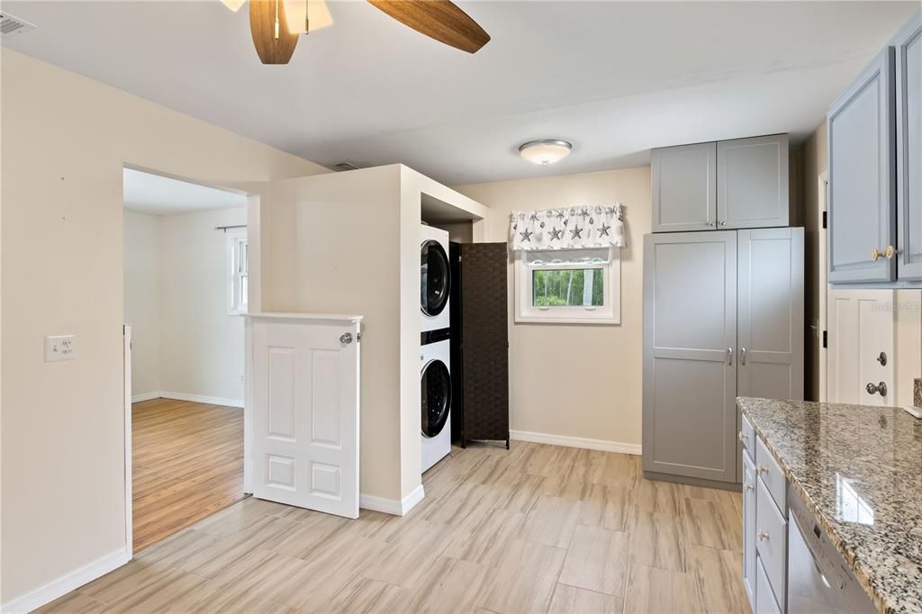 Kitchen with laundry and additional storage!